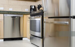 stainless appliances in white kitchen